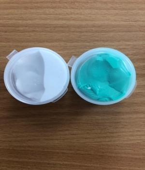 Green and White Putty in containers